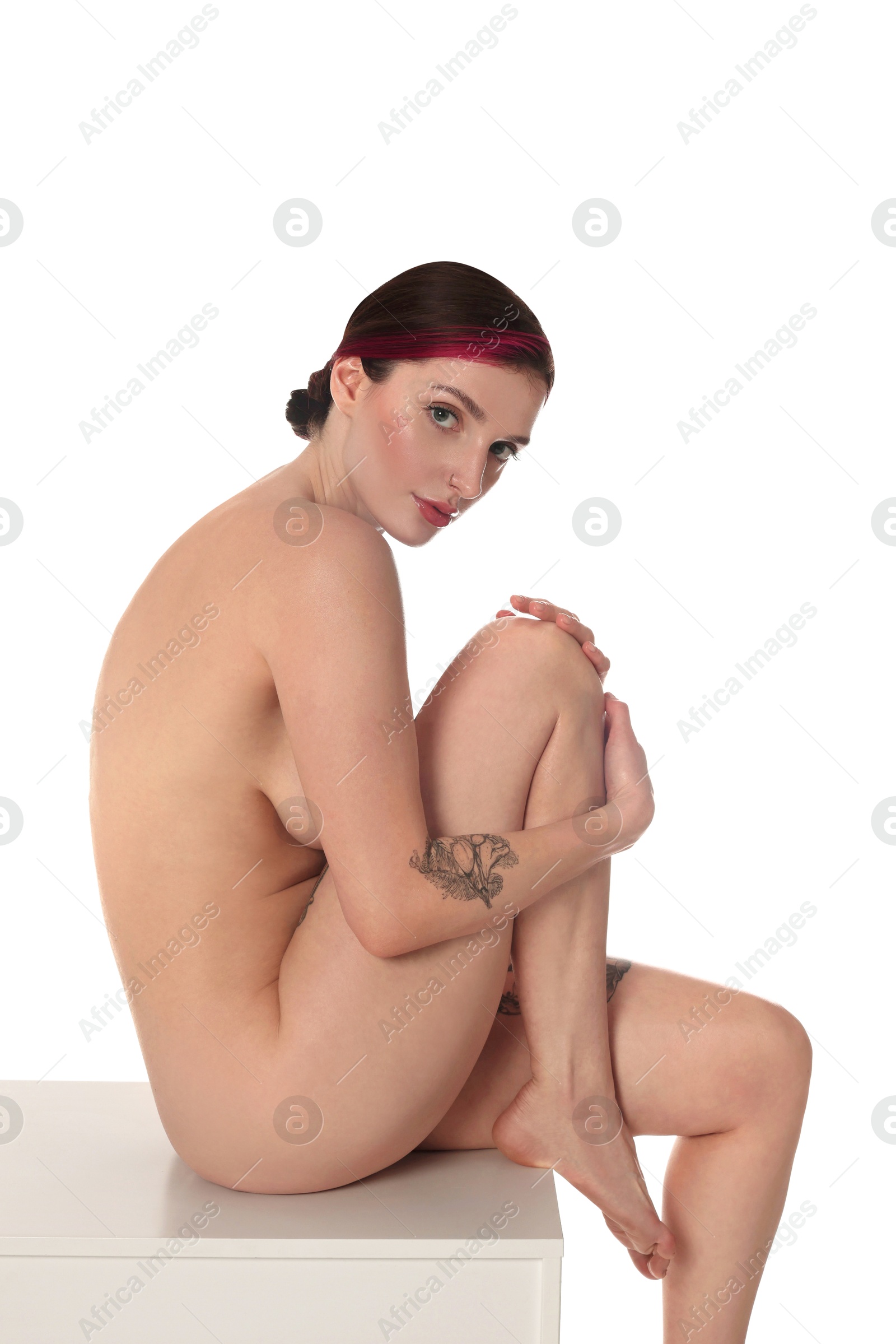 Photo of Beautiful nude woman posing on white background