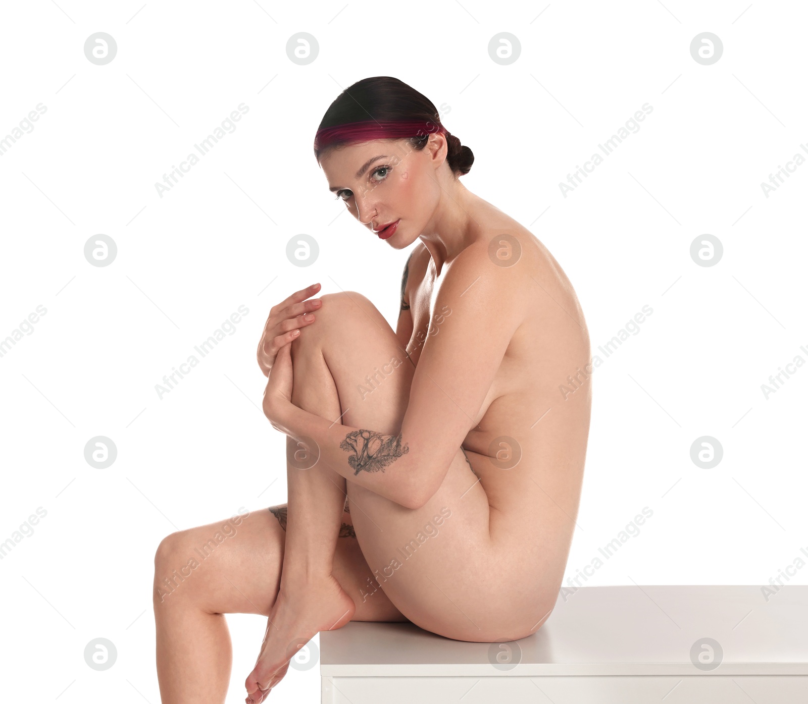 Photo of Beautiful nude woman posing on white background