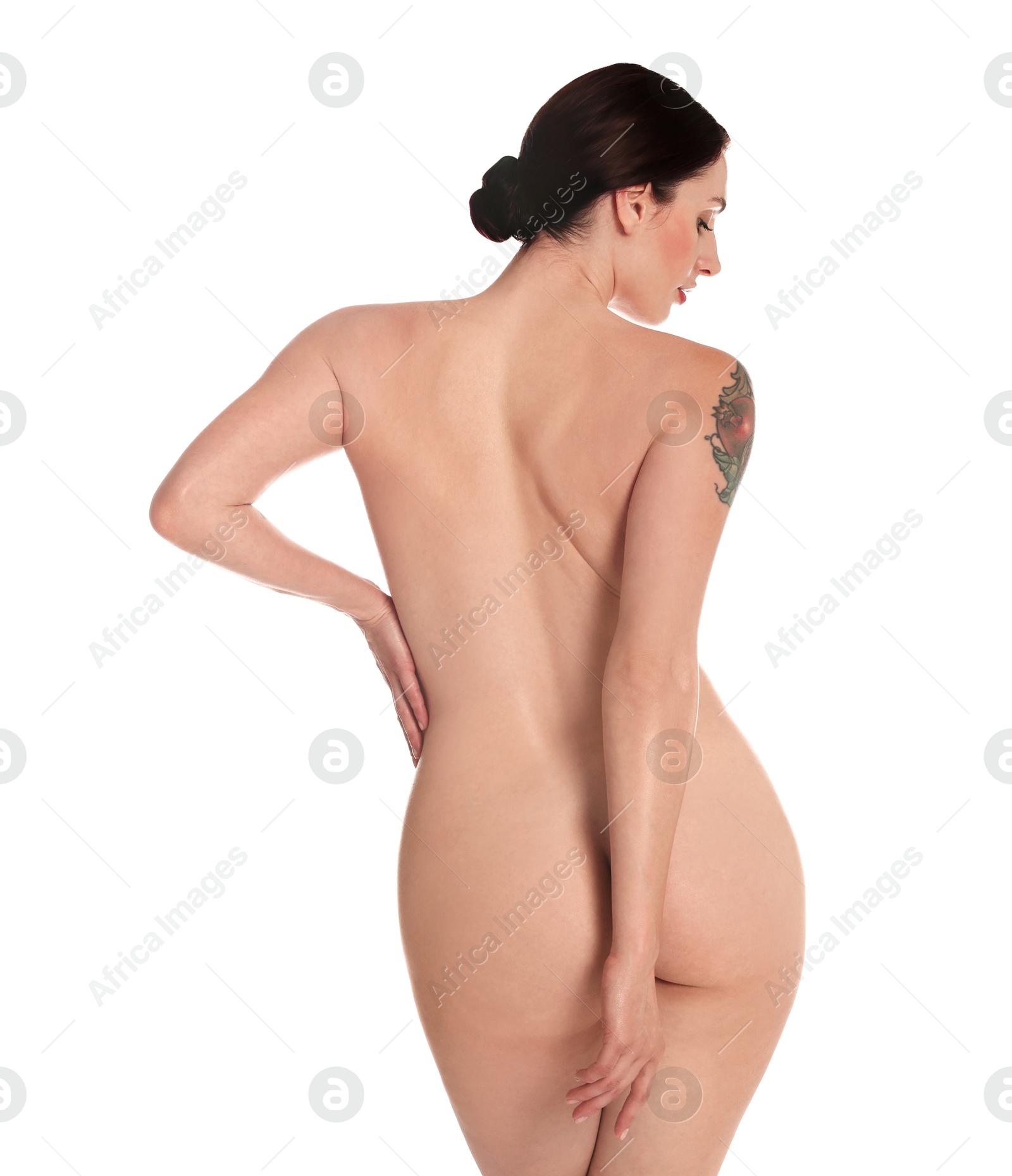 Photo of Nude woman posing on white background, back view