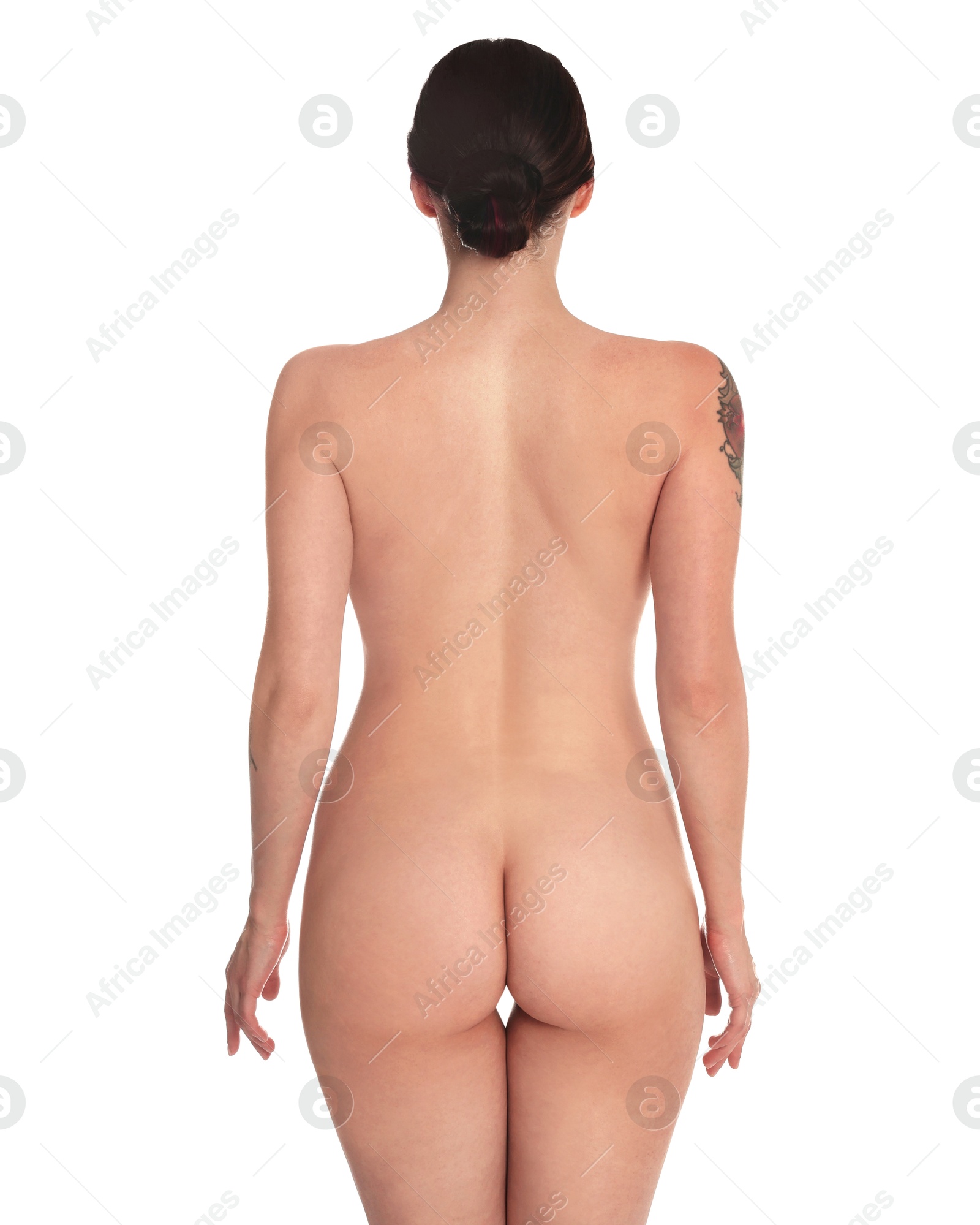 Photo of Nude woman posing on white background, back view