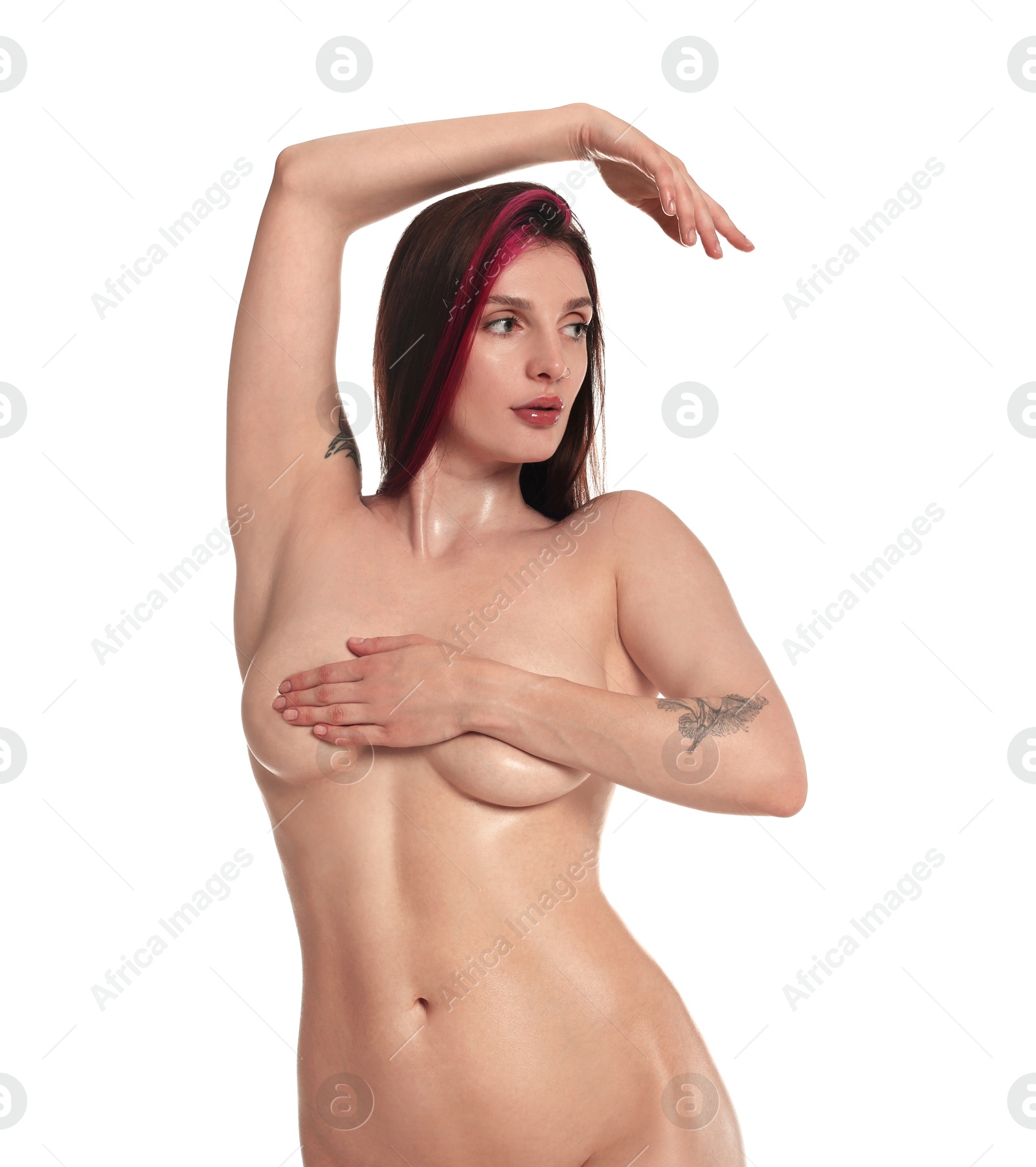 Photo of Beautiful nude woman with tattoo posing on white background