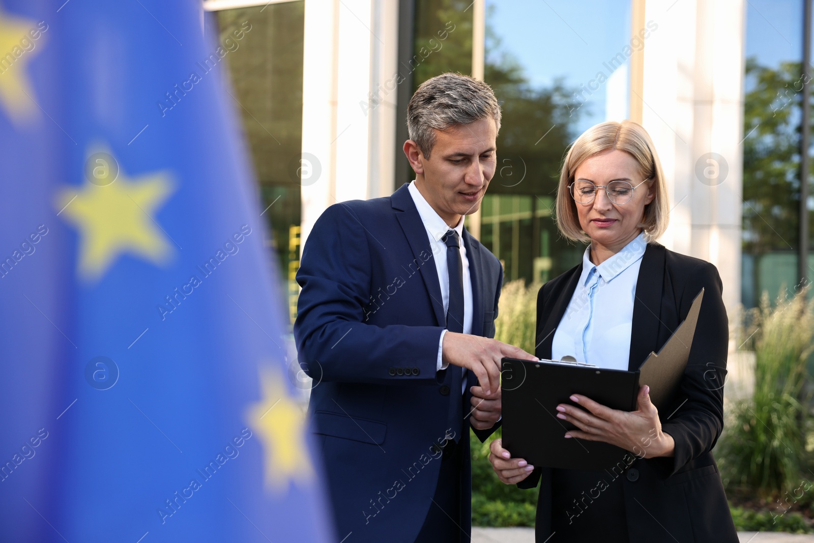 Photo of International relations. Diplomats talking during meeting outdoors