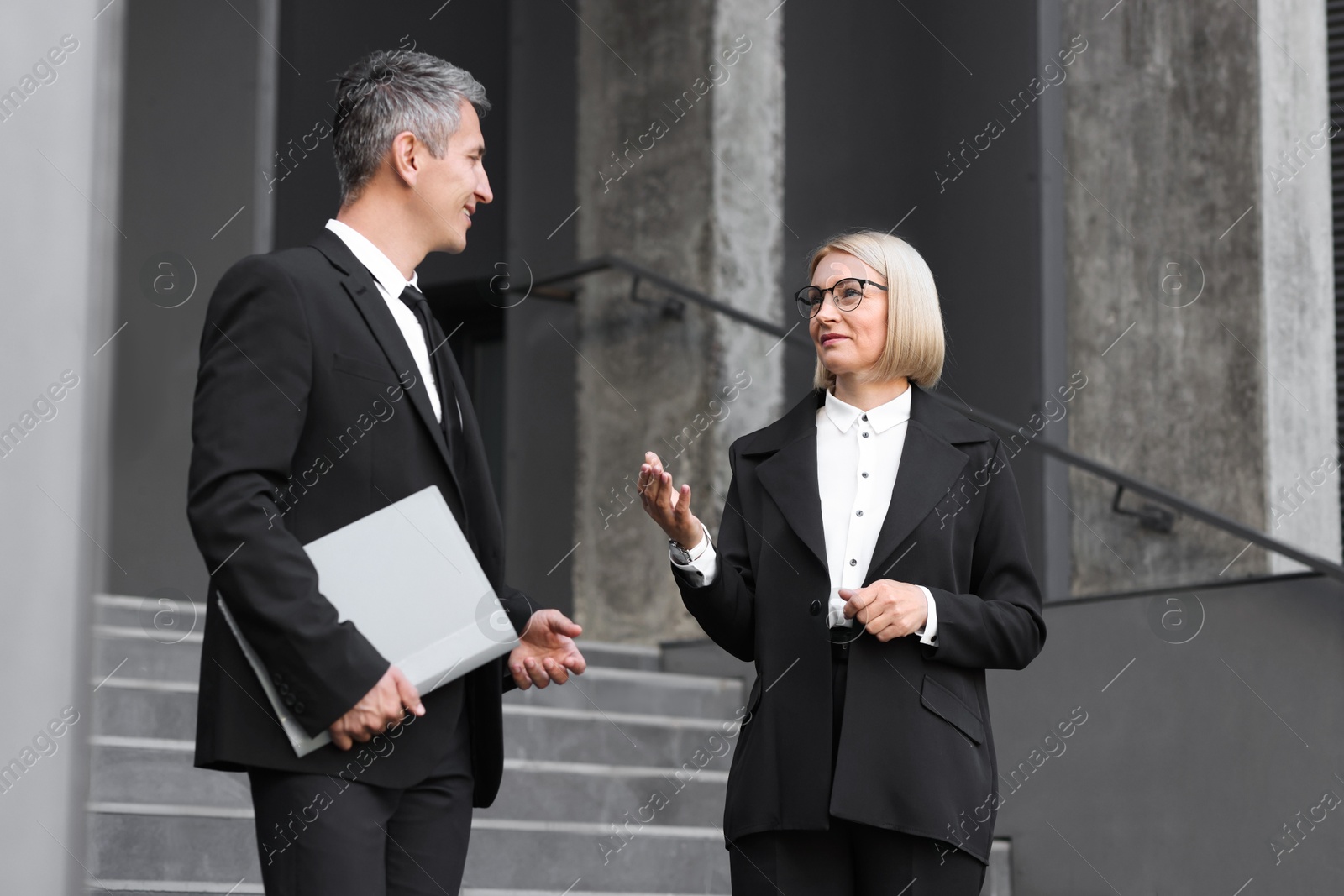 Photo of International relations. Diplomats talking during meeting outdoors