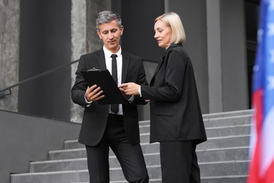 Photo of International relations. Diplomats talking during meeting outdoors