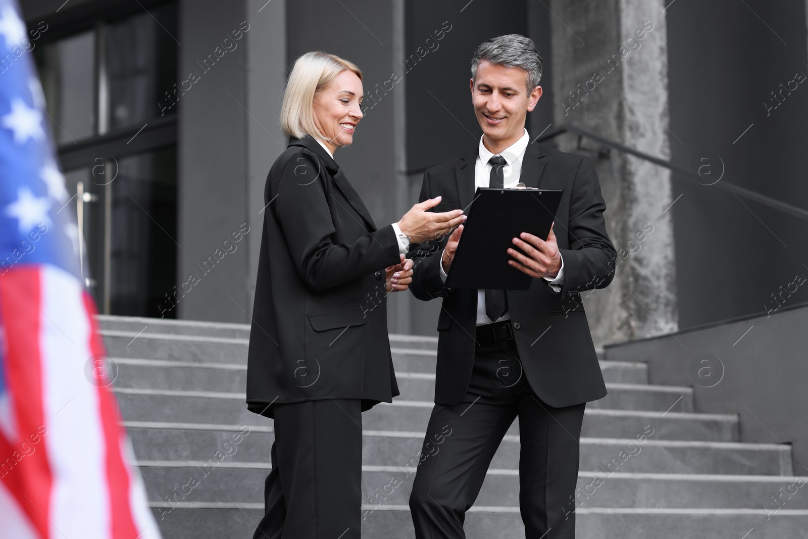 Photo of International relations. Diplomats talking during meeting outdoors