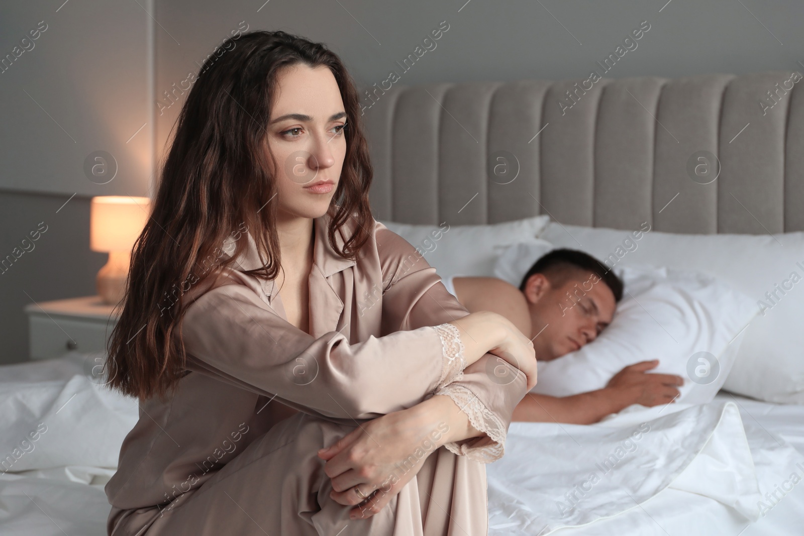 Photo of Offended couple after quarrel in bedroom. Relationship problem