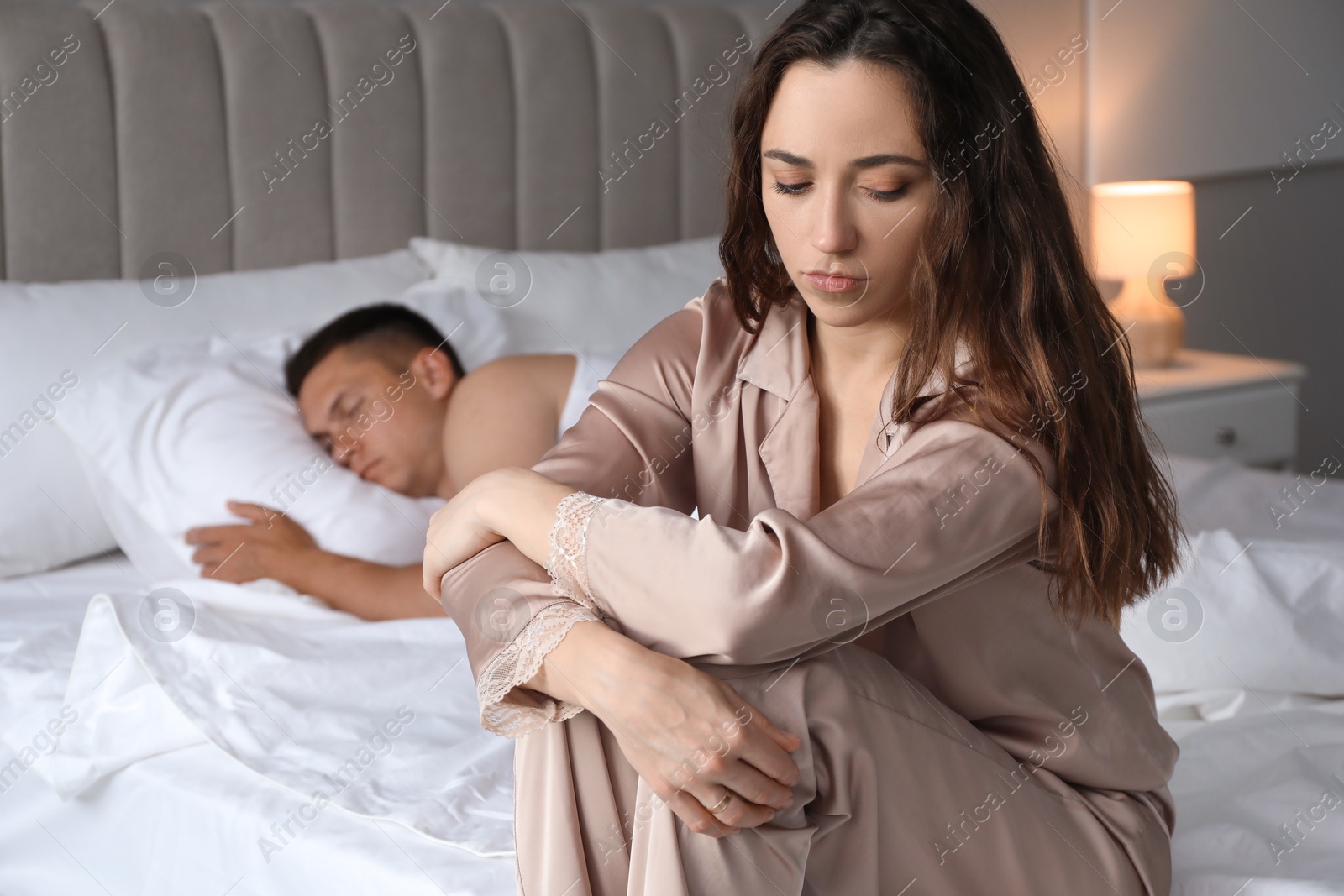 Photo of Offended couple after quarrel in bedroom. Relationship problem