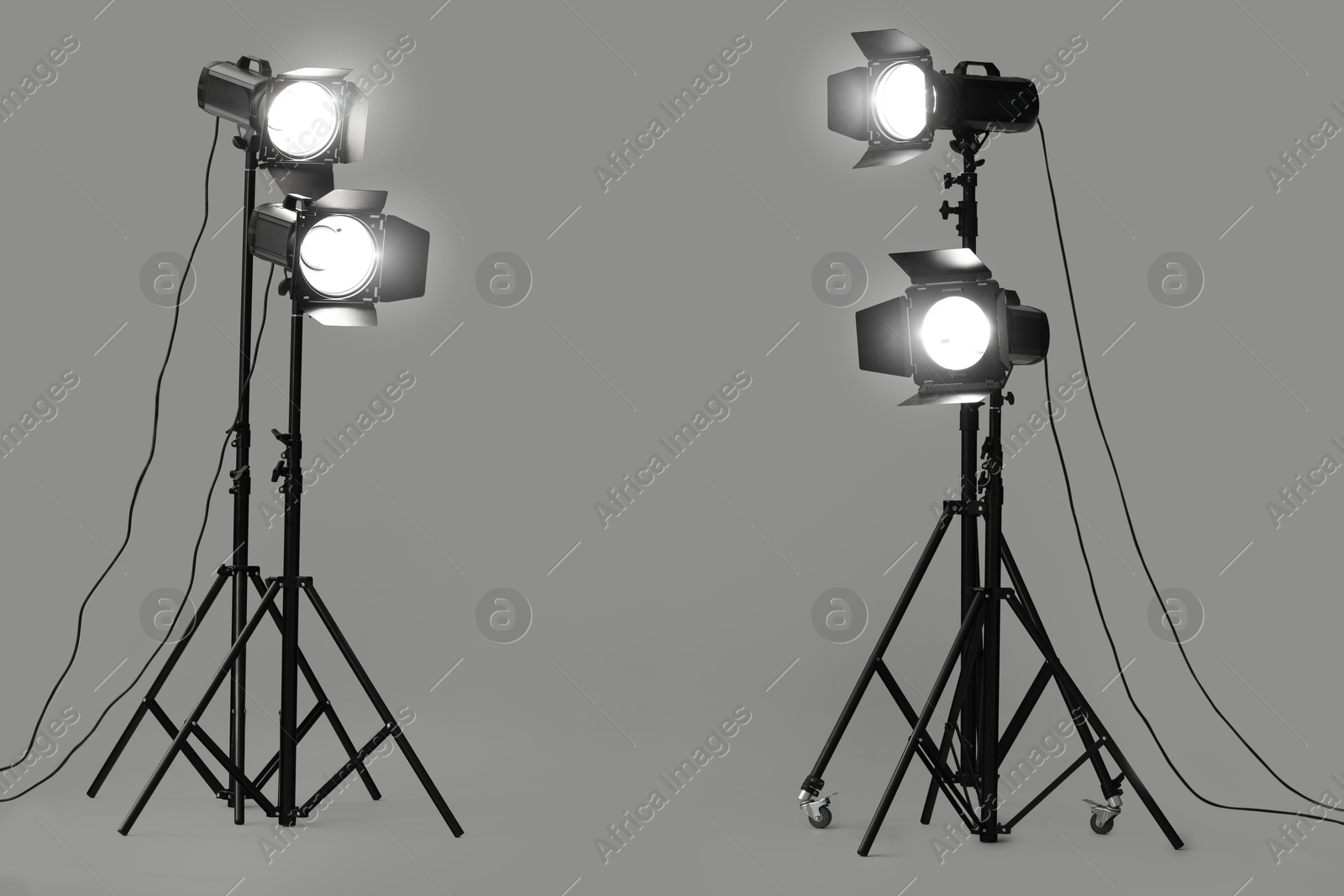 Photo of Grey photo background and professional lighting equipment in studio