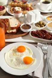 Photo of Different meals served for breakfast on table