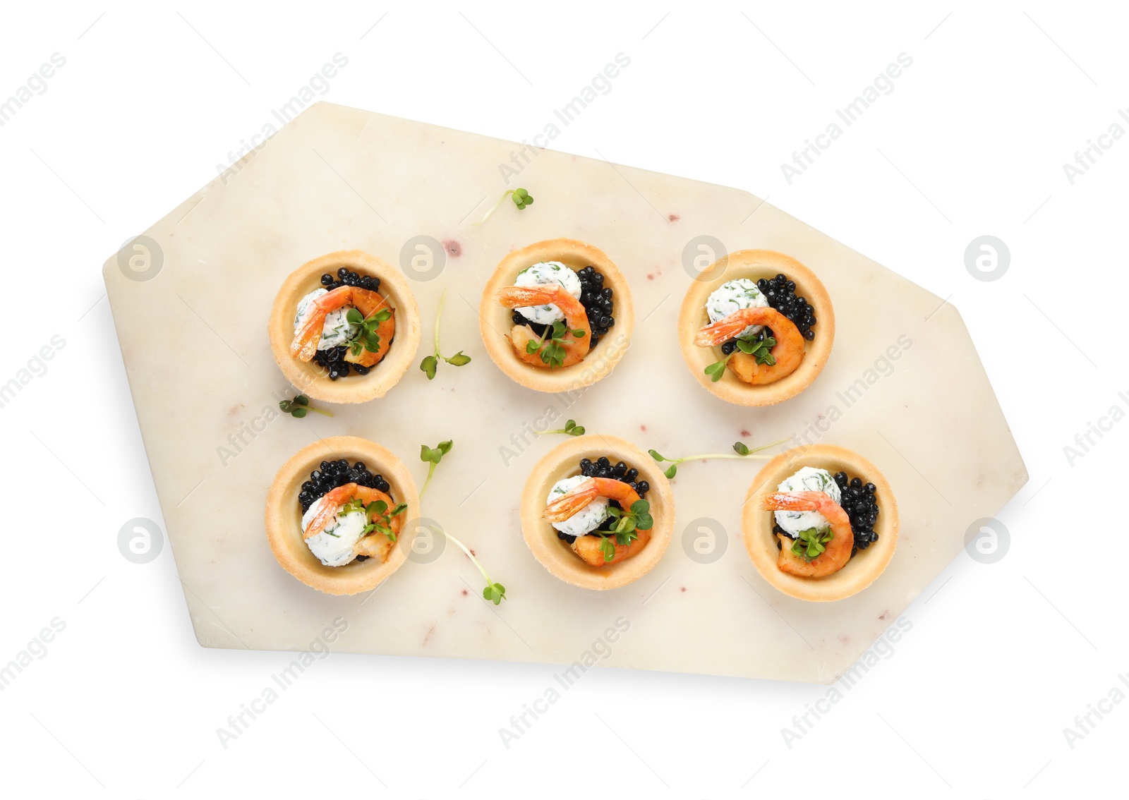 Photo of Delicious canapes with shrimps and black caviar isolated on white, top view