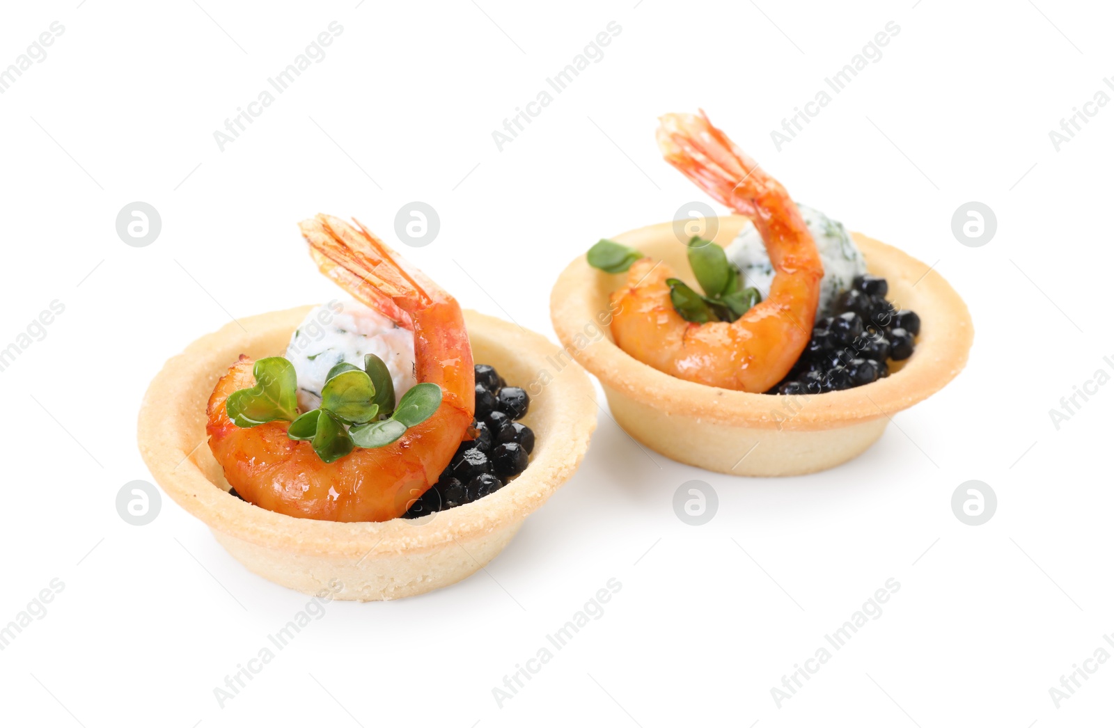 Photo of Delicious canapes with shrimps and black caviar isolated on white