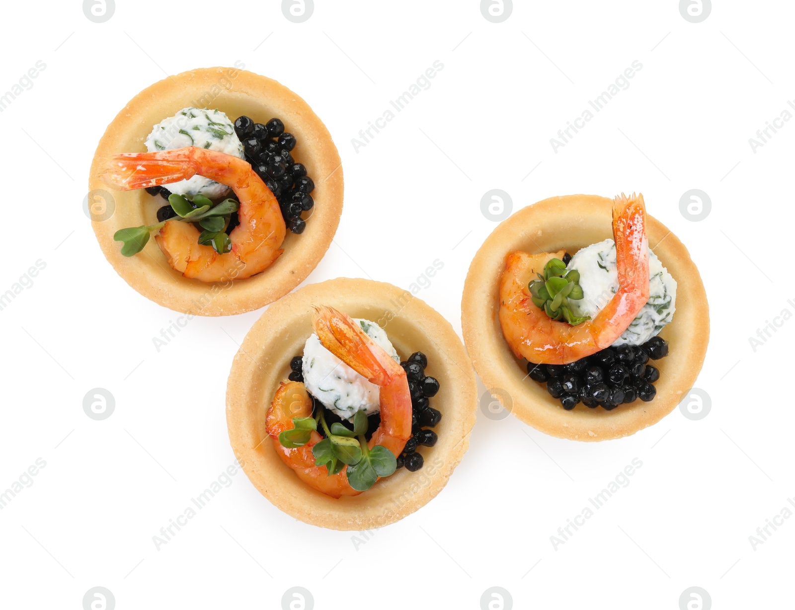 Photo of Delicious canapes with shrimps and black caviar isolated on white, top view