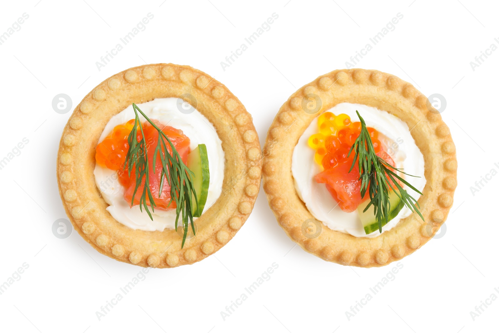 Photo of Delicious canapes with salmon and red caviar isolated on white, top view