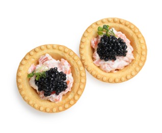 Photo of Delicious canapes with black caviar isolated on white, top view