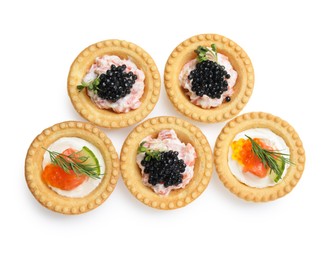 Photo of Delicious canapes with salmon and caviar isolated on white, top view