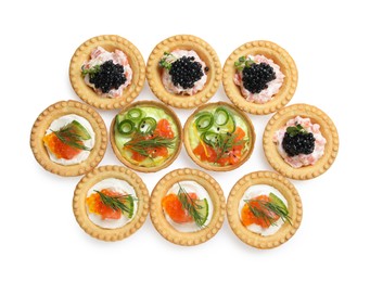 Delicious canapes with salmon and caviar isolated on white, top view