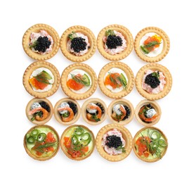 Photo of Delicious canapes with shrimps, salmon and caviar isolated on white, top view