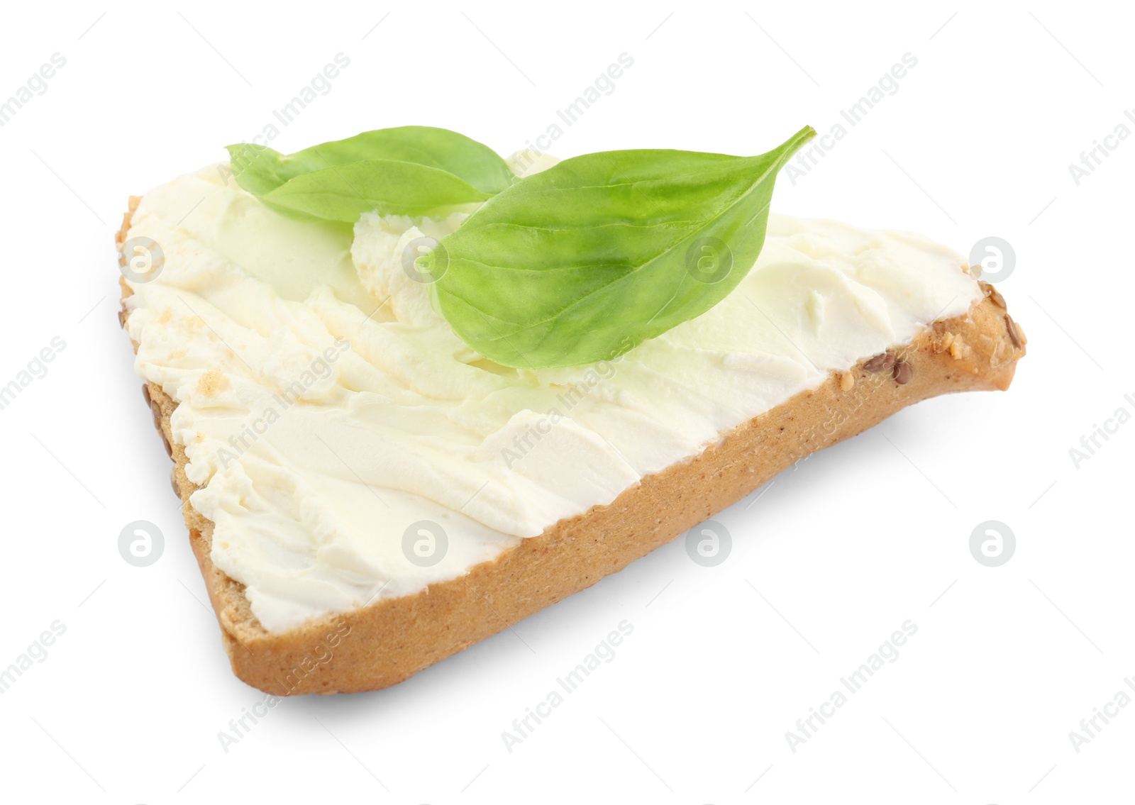 Photo of Piece of bread with cream cheese and basil leaves isolated on white