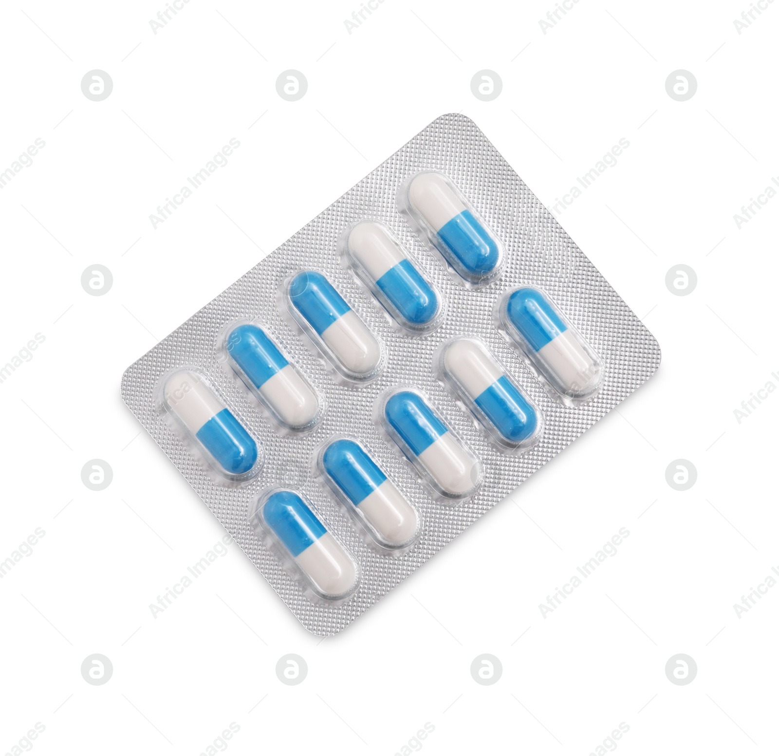 Photo of Antibiotic pills in blister isolated on white, top view