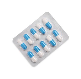 Photo of Antibiotic pills in blister isolated on white, top view