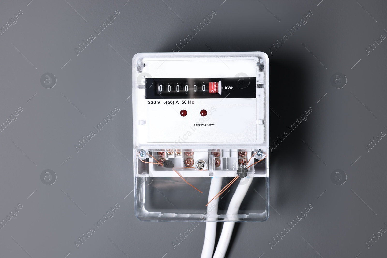 Photo of Electric meter on black background. Energy measuring device