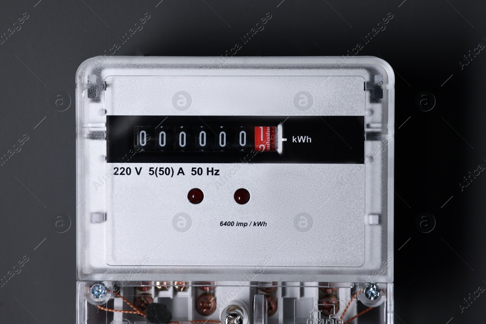 Photo of Electric meter on black background. Energy measuring device