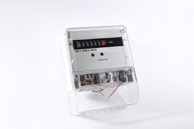 Photo of Electric meter on white background. Energy measuring device