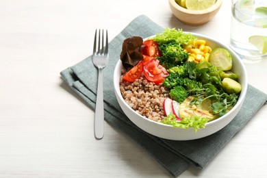 Photo of Healthy meal. Tasty products in bowl on white table, space for text