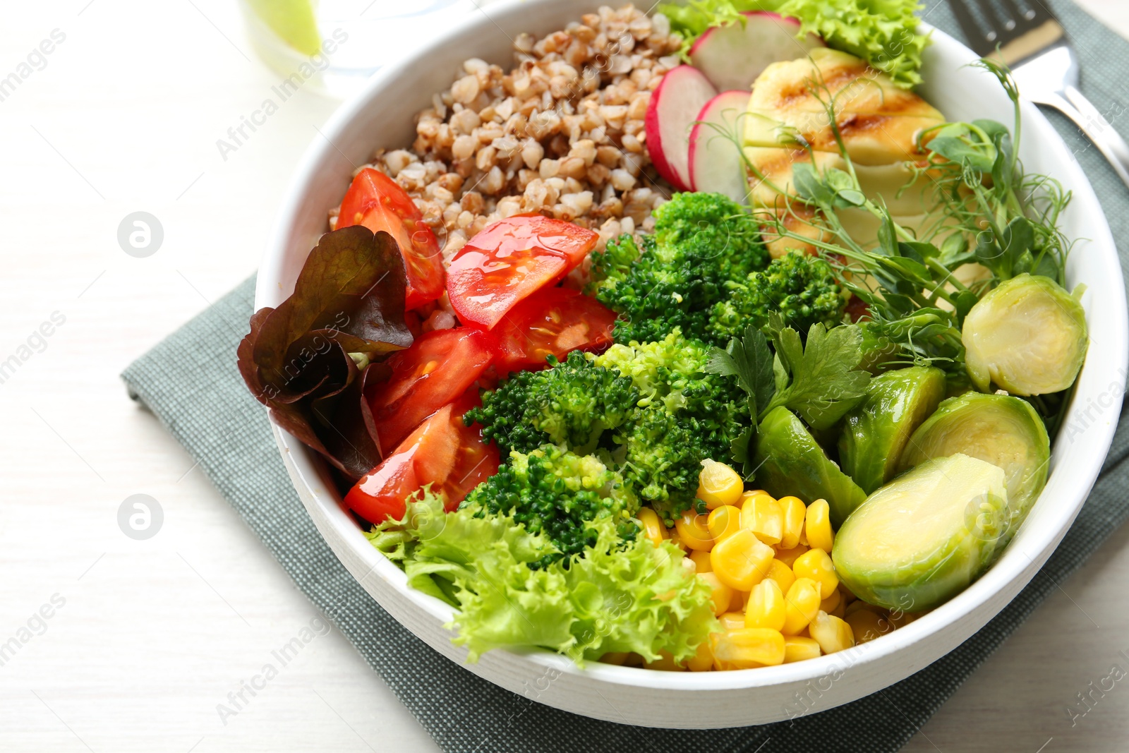 Photo of Healthy meal. Tasty products in bowl on white table, closeup