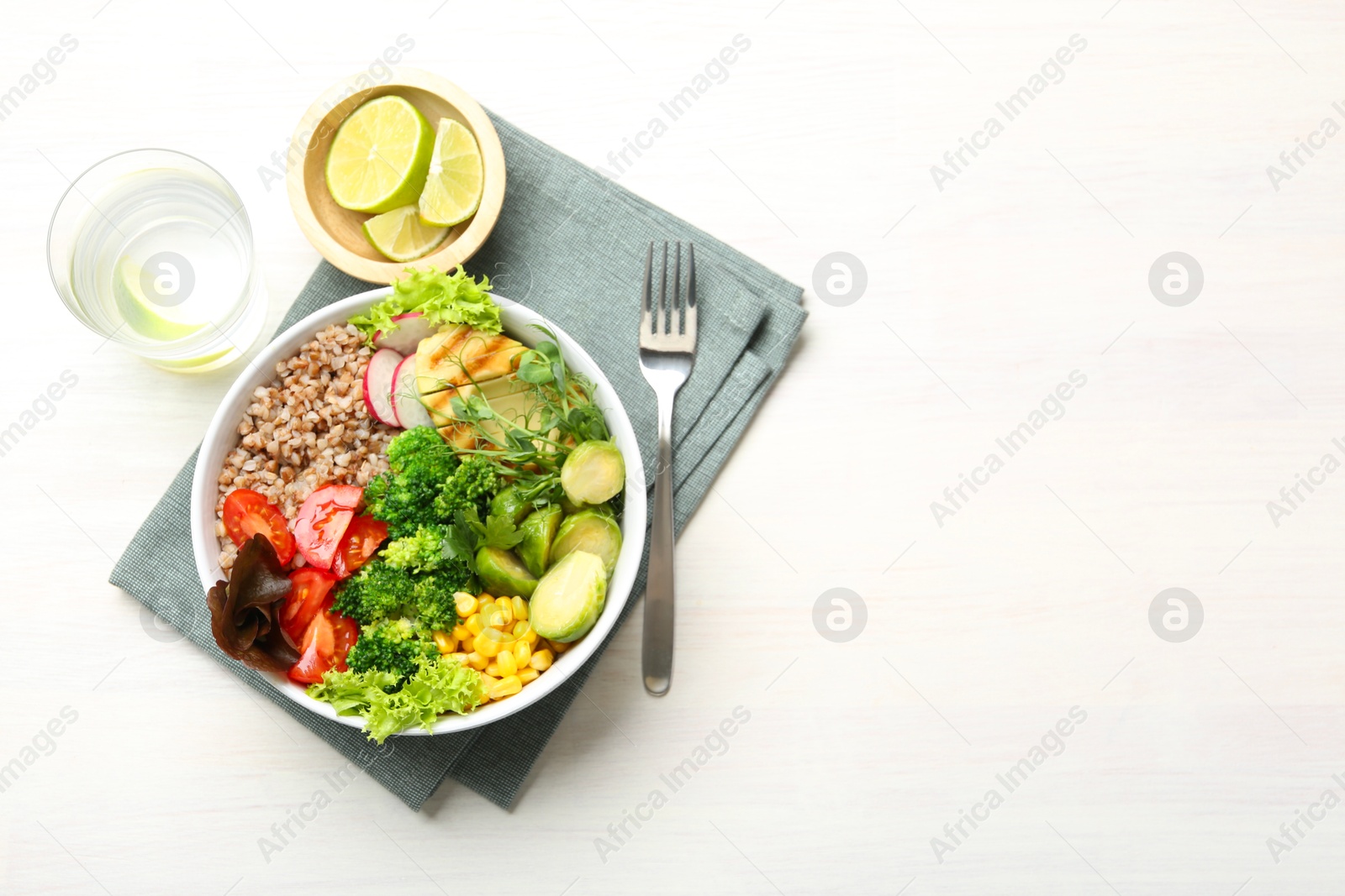 Photo of Healthy meal. Tasty products in bowl on white table, top view. Space for text