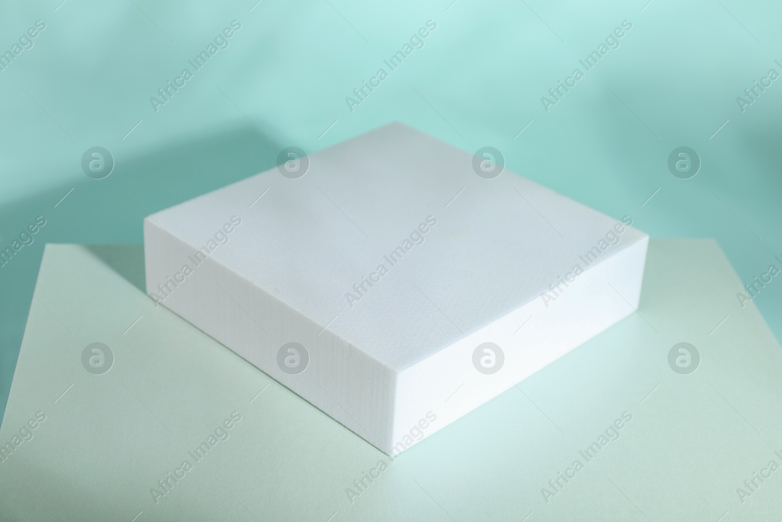Photo of Presentation of product. Podiums and shadows on turquoise background. Space for text
