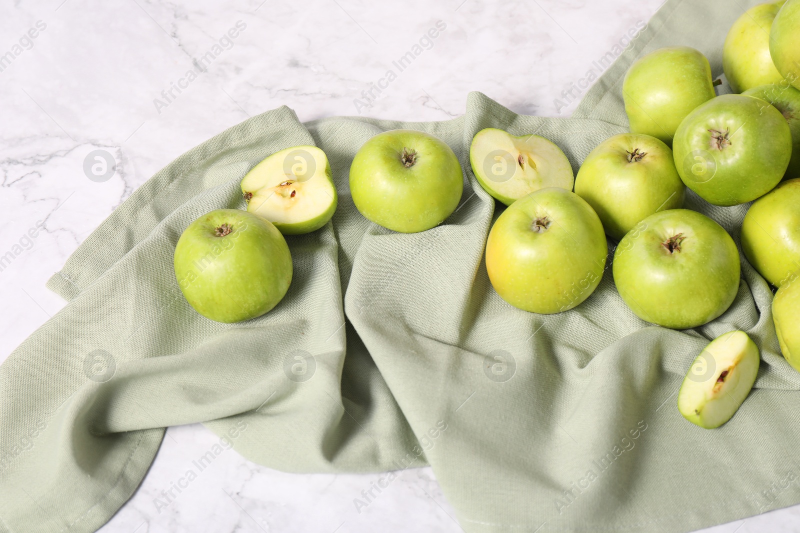 Photo of Fresh ripe green apples on white marble table