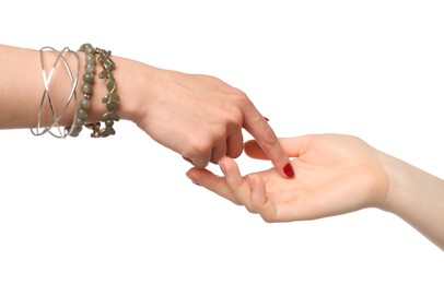 Fortune teller reading lines on woman's palm against white background. Chiromancy