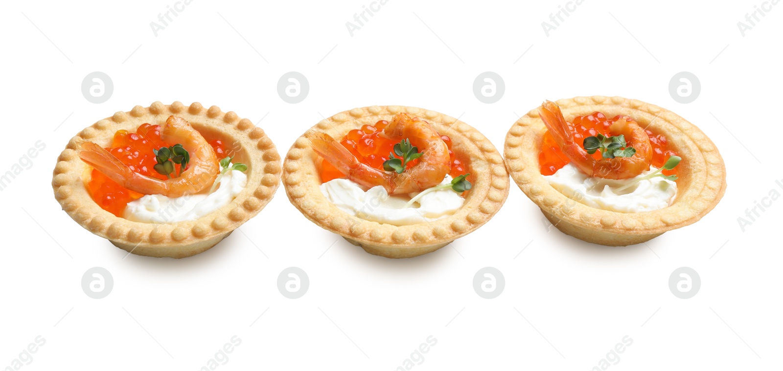 Photo of Delicious canapes with shrimps, red caviar and cream cheese isolated on white