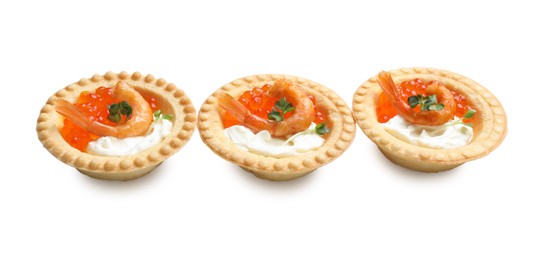 Delicious canapes with shrimps, red caviar and cream cheese isolated on white