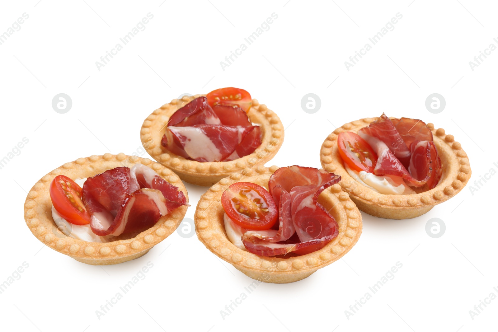 Photo of Delicious canapes with jamon, cream cheese and cherry tomatoes isolated on white