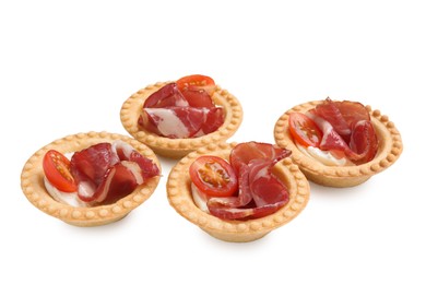 Delicious canapes with jamon, cream cheese and cherry tomatoes isolated on white