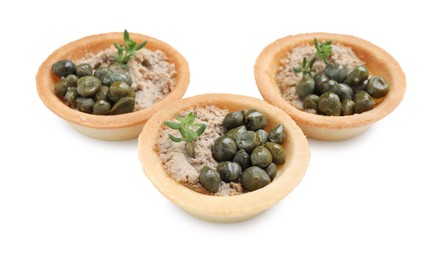 Delicious canapes with pate, capers and microgreens isolated on white