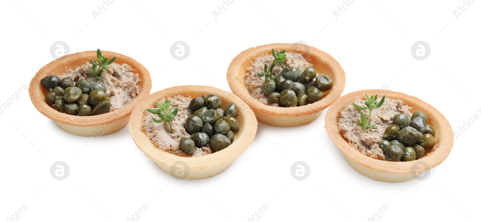 Photo of Delicious canapes with pate, capers and microgreens isolated on white