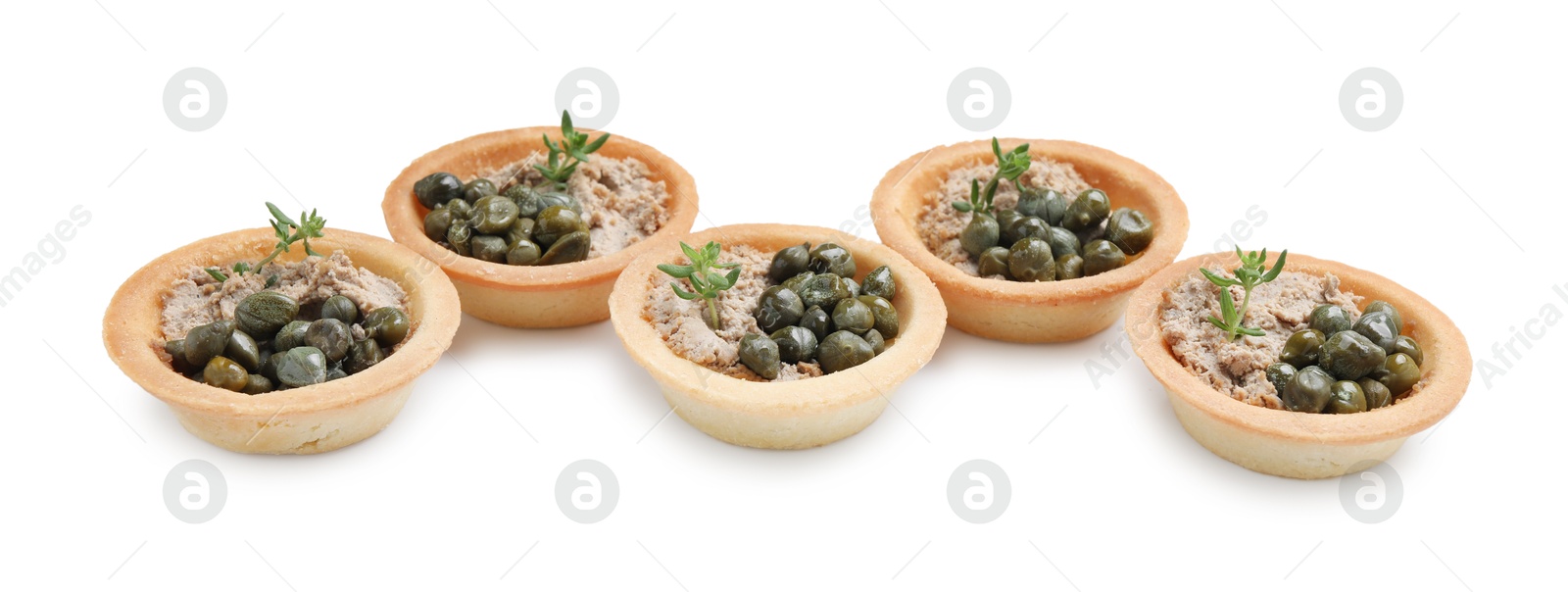 Photo of Delicious canapes with pate, capers and microgreens isolated on white