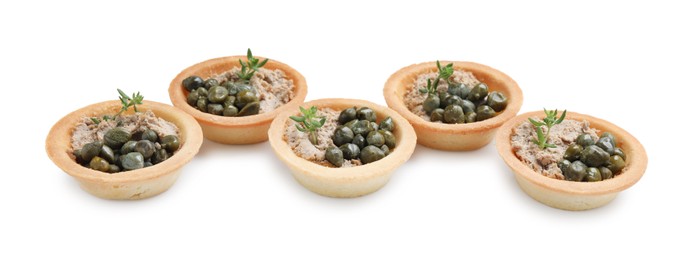 Delicious canapes with pate, capers and microgreens isolated on white