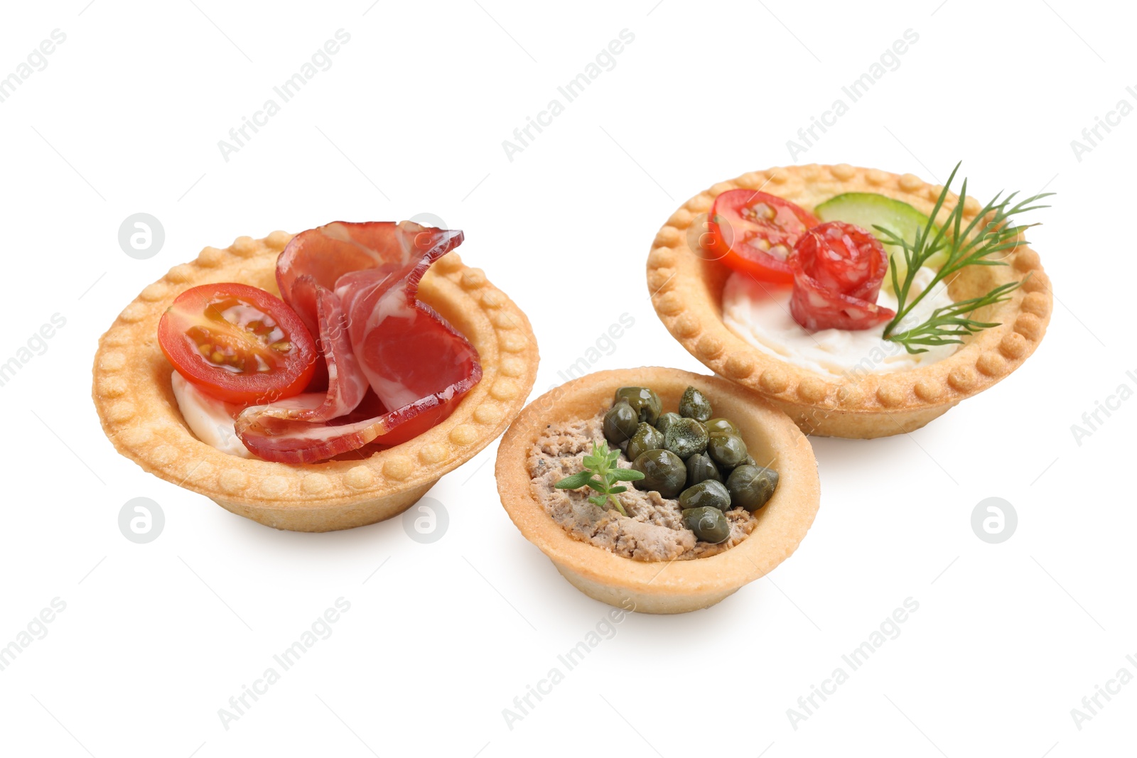 Photo of Delicious canapes with dry smoked sausage, jamon and pate isolated on white