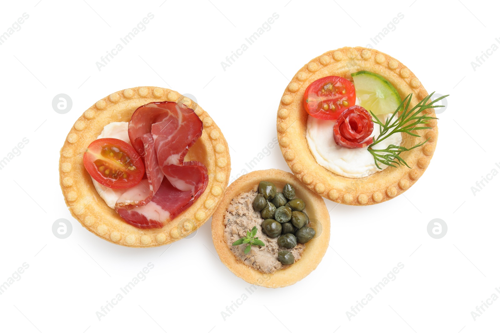 Photo of Delicious canapes with dry smoked sausage, jamon and pate isolated on white, top view