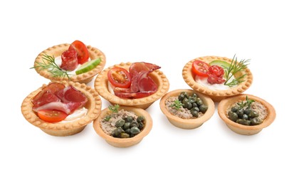 Photo of Delicious canapes with dry smoked sausages, jamon and pate isolated on white