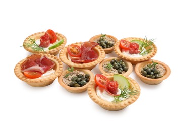 Delicious canapes with dry smoked sausages, jamon and pate isolated on white