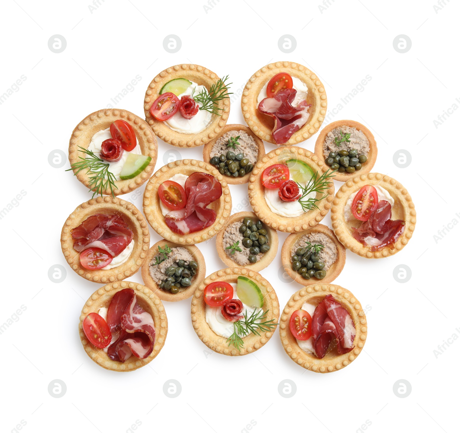 Photo of Delicious canapes with dry smoked sausages, jamon and pate isolated on white, top view