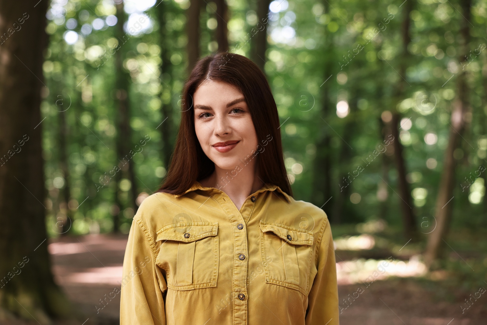 Photo of Portrait of beautiful woman in forest. Spring vibes