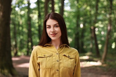 Portrait of beautiful woman in forest. Spring vibes