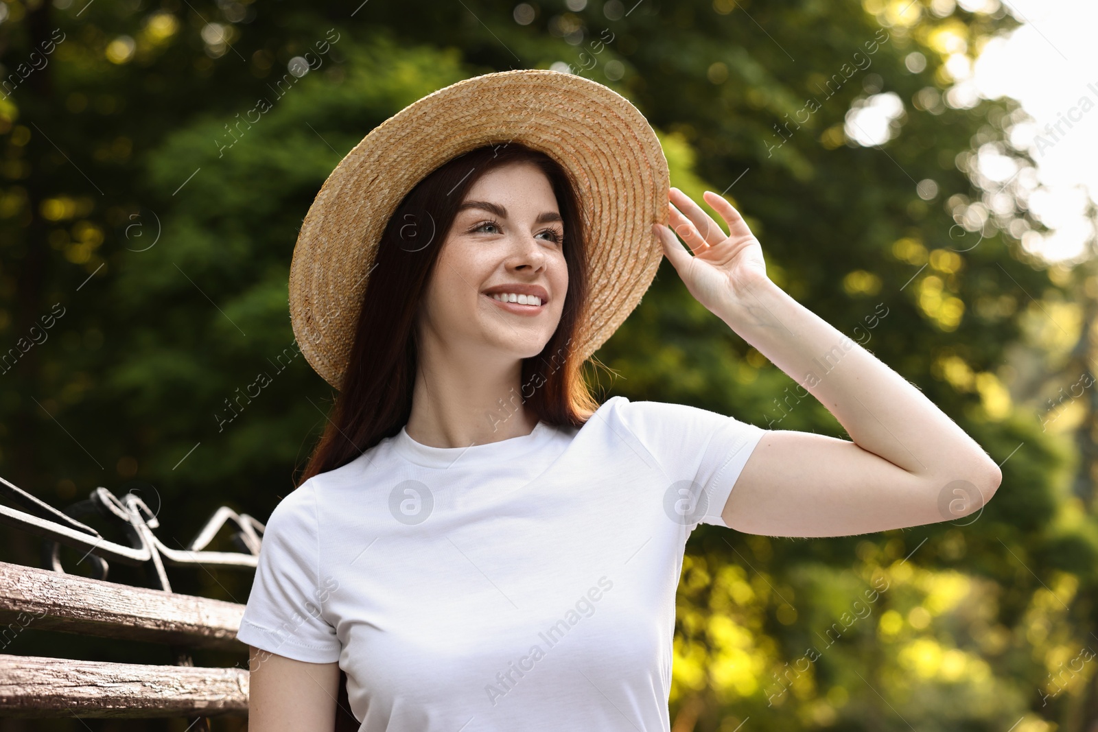 Photo of Portrait of smiling woman in hat outdoors. Spring vibes