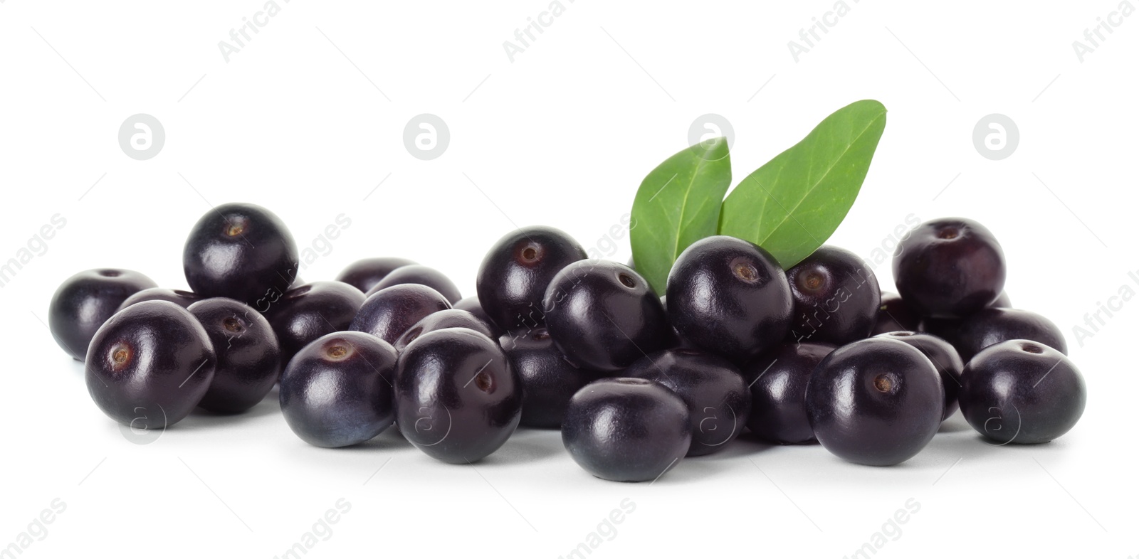 Photo of Fresh ripe acai berries and green leaves isolated on white